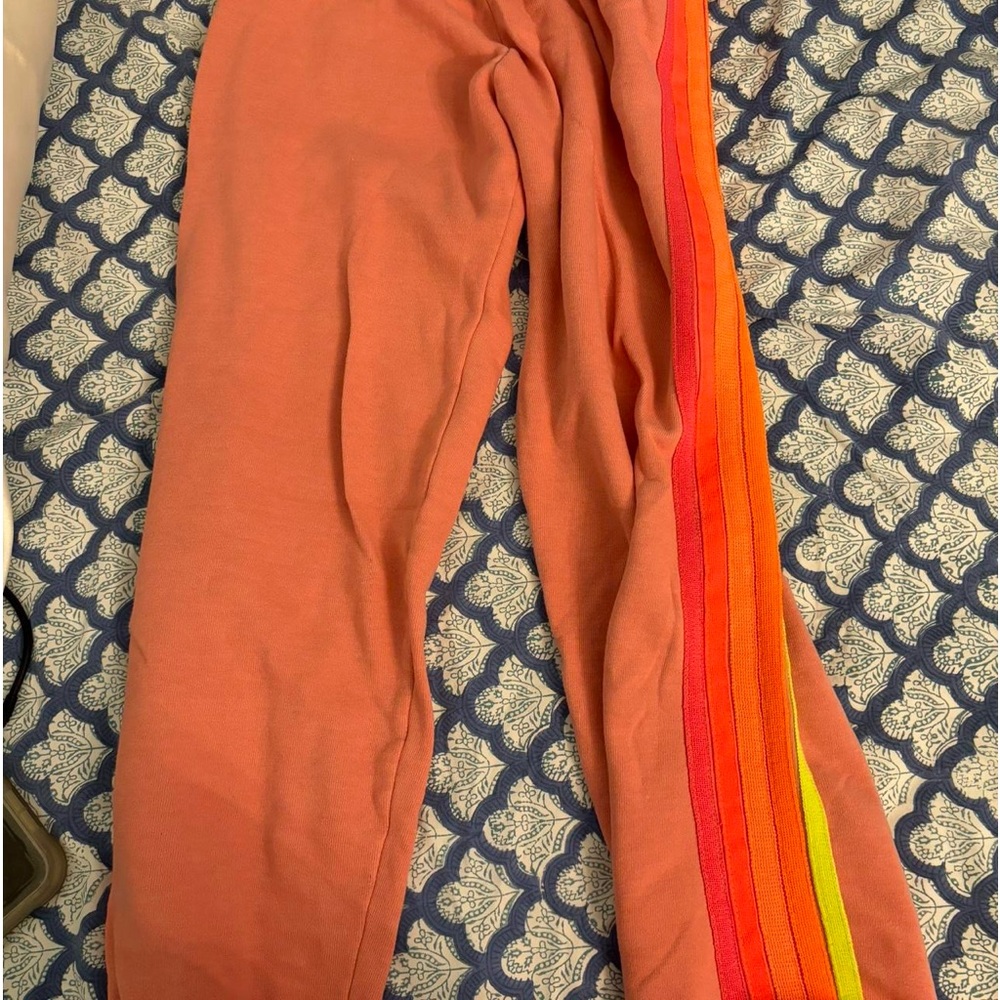 pink AV sweatpants with sunset striped colors.